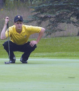 Eric Lilleboe Analyzes His Angle for a Put <span class='credit'>Photo By: Kristyn Sonnenberg | Photo Editor</span><span class='description'>Senior Eric Lilleboe analyzes his angle for a put into hole two at Saturday’s tournament. Lilleboe was a first place medalist with his even-par 210 score.</span>