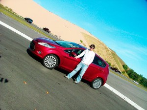 Bryan Redeker with the Ford Fiesta <span class='credit'>Photo Courtesy of Bryan Redeker</span><span class='description'>Redeker was one of 100 people chosen to take part in the Ford Fiesta Movement, traveling the country to help the buzz about the new vehicle that will soon be available in the U.S.</span>