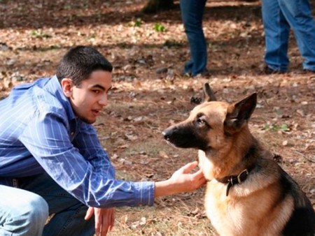 Pet Savers: Gabe Laney gives “Angel” some attention. Pet Savers, a registered student organization called Pet Savers has been formed on campus by Professor Cate Arroe and now has a membership of 15 students who wish to stem the tide of pet abandonment and help find them homes. Photo courtesy of Cate Arroe